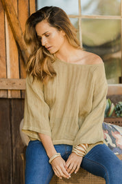 Model Ilona wearing size 10 of the Sheer Delight Linen Knit Throw Top in colour Olive (Green), from the front, showing the whole outfit