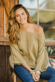 Model Ilona wearing size 10 of the Sheer Delight Linen Knit Throw Top in colour Olive (Green), from the front, showing the whole outfit