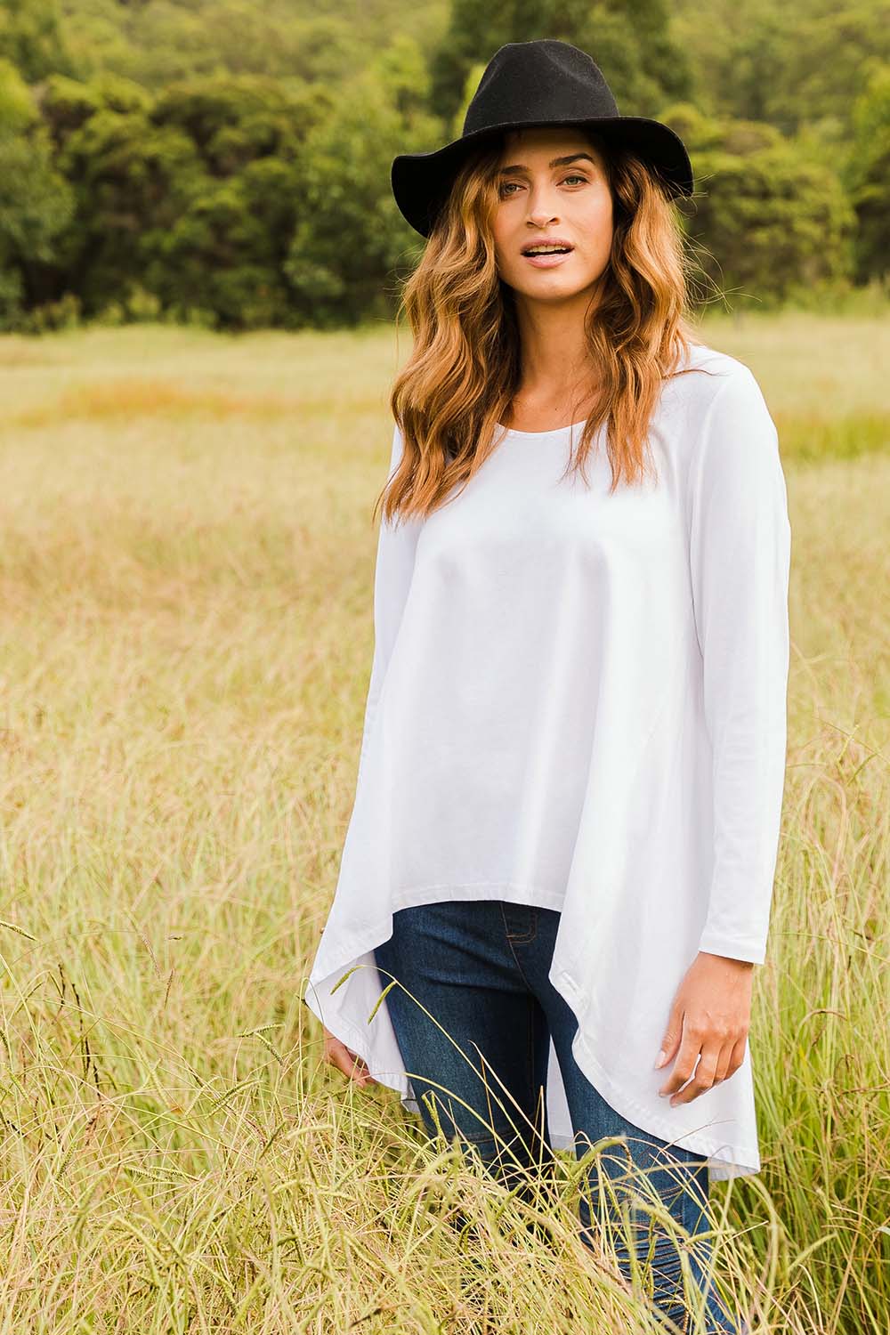 Model Ilona wearing size 10 of the Sunshine In Me Long Sleeve Tee in colour White (White), from the front, showing the whole outfit