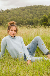 Model Ilona wearing size 10 of the Paper Daisy High Waisted Jeans in colour Denim (Blue), from the front, showing the whole outfit