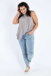 Model Sasha-Lee wearing size 16 of the Paper Daisy High Waisted Jeans in colour Denim (Blue), from the front, showing the whole outfit