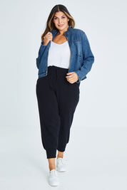 Model Palatina wearing size 16 of the I Have Got This Denim Jacket in colour Denim (Blue), from the front, showing the whole outfit