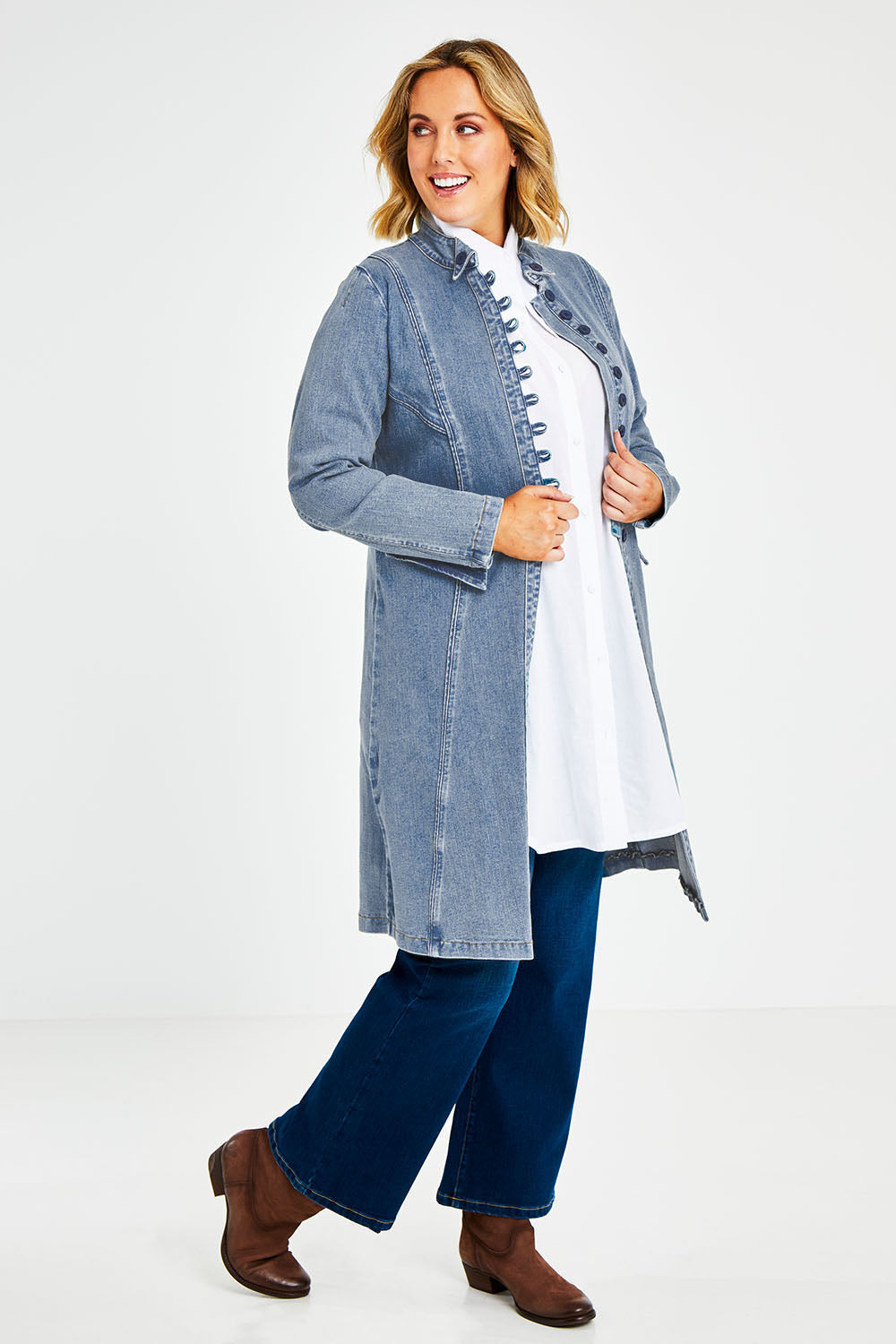 Model Jess wearing size 14 of the Attention To Me Denim Jacket in colour Lightdenim (Blue), from the front, showing the whole outfit