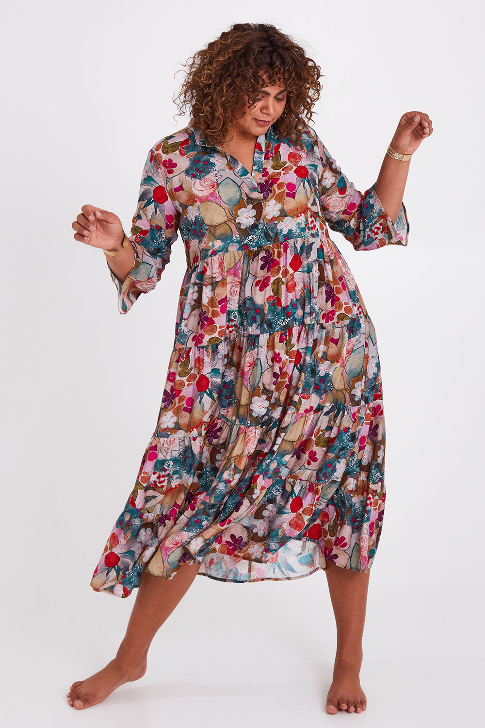 Model Anucia wearing size 14 of the Its Easy Loving You Tiered Dress in colour Fleur (Green), from the front, showing the whole outfit