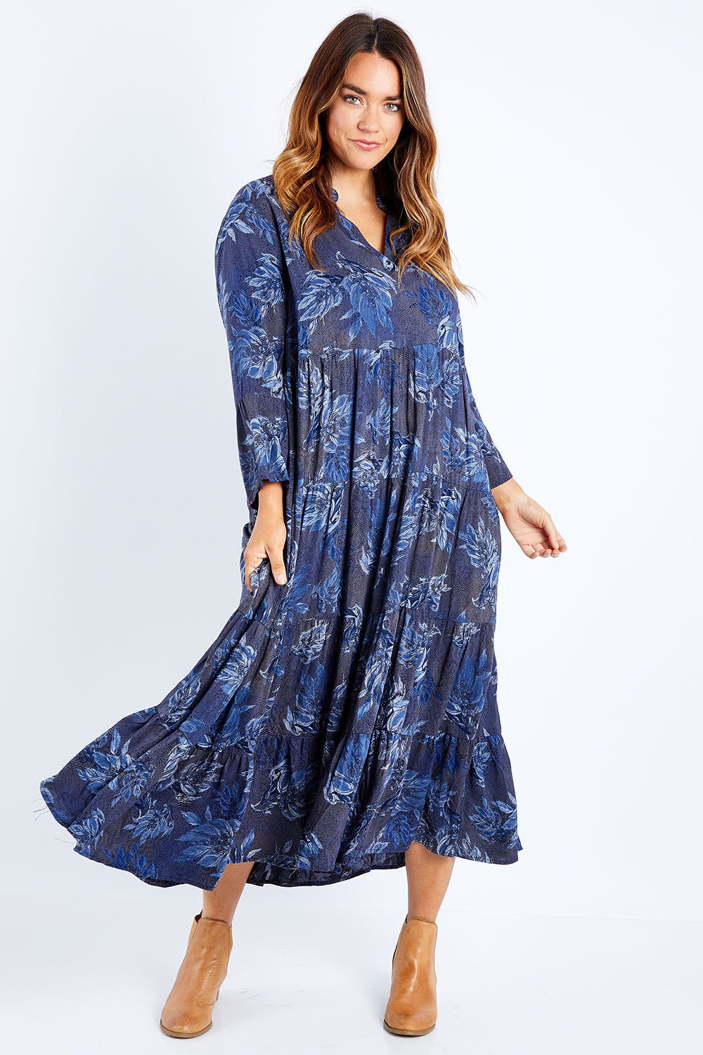 Model Laura wearing size 14 of the Its Easy Loving You Tiered Dress in colour Bluefleur (Blue), from the front, showing the whole outfit