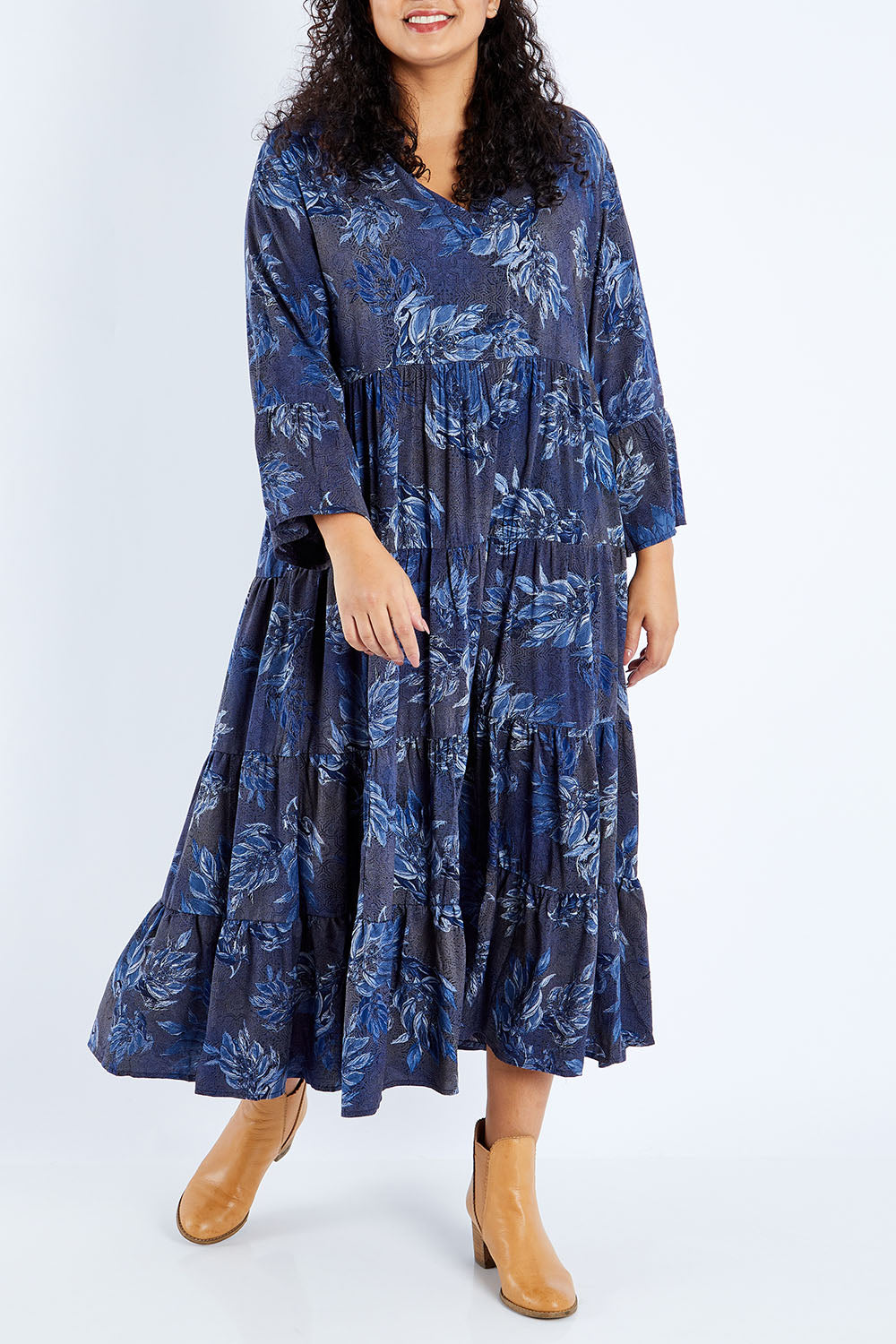 Model Sasha-Lee wearing size 16 of the Its Easy Loving You Tiered Dress in colour Bluefleur (Blue), from the front, cropped image
