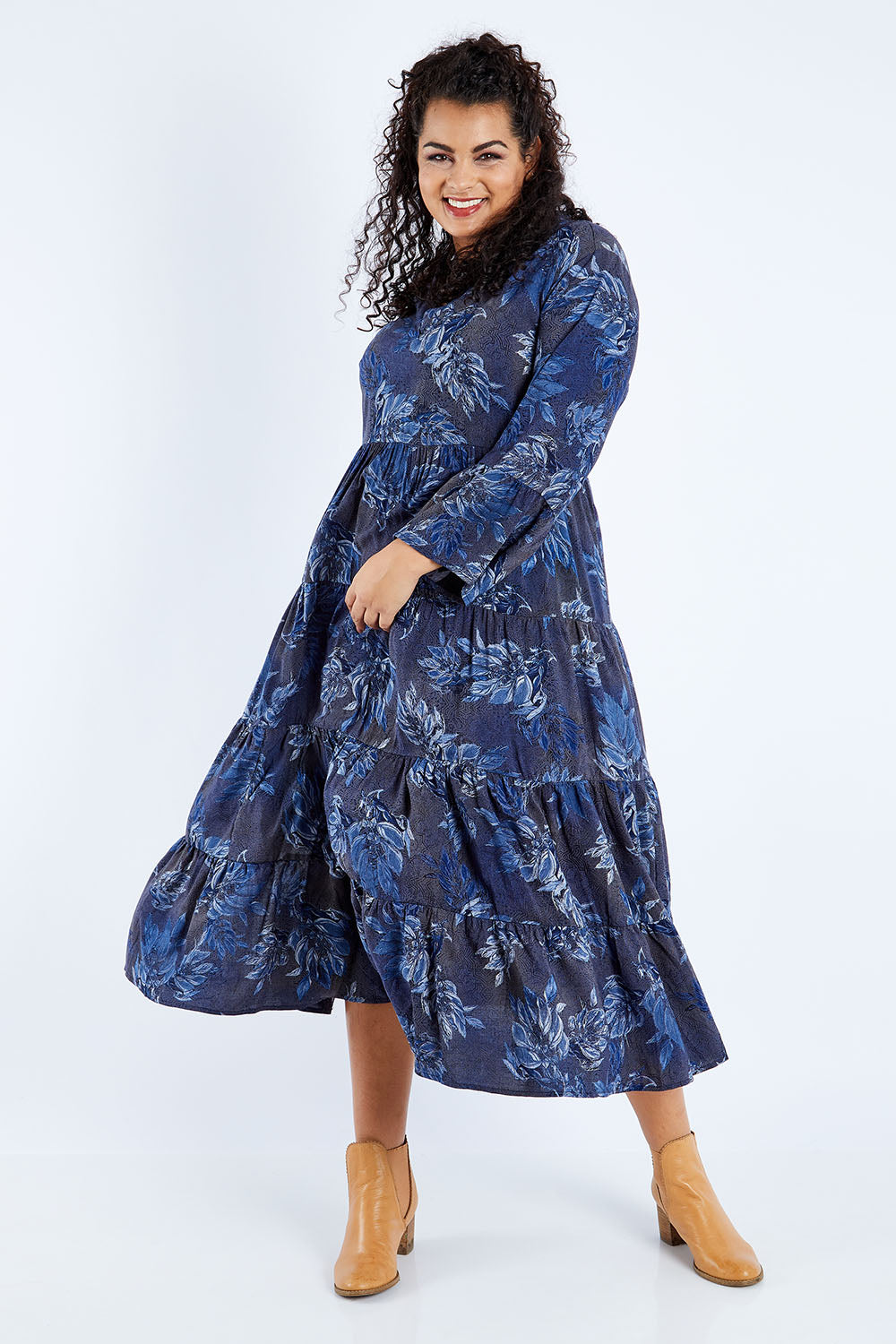 Model Sasha-Lee wearing size 16 of the Its Easy Loving You Tiered Dress in colour Bluefleur (Blue), from the front, showing the whole outfit