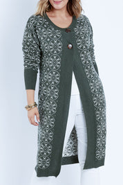 Model Jess wearing size L of the Fields Of Folly Cardi in colour Forest (Green), from the front, cropped image