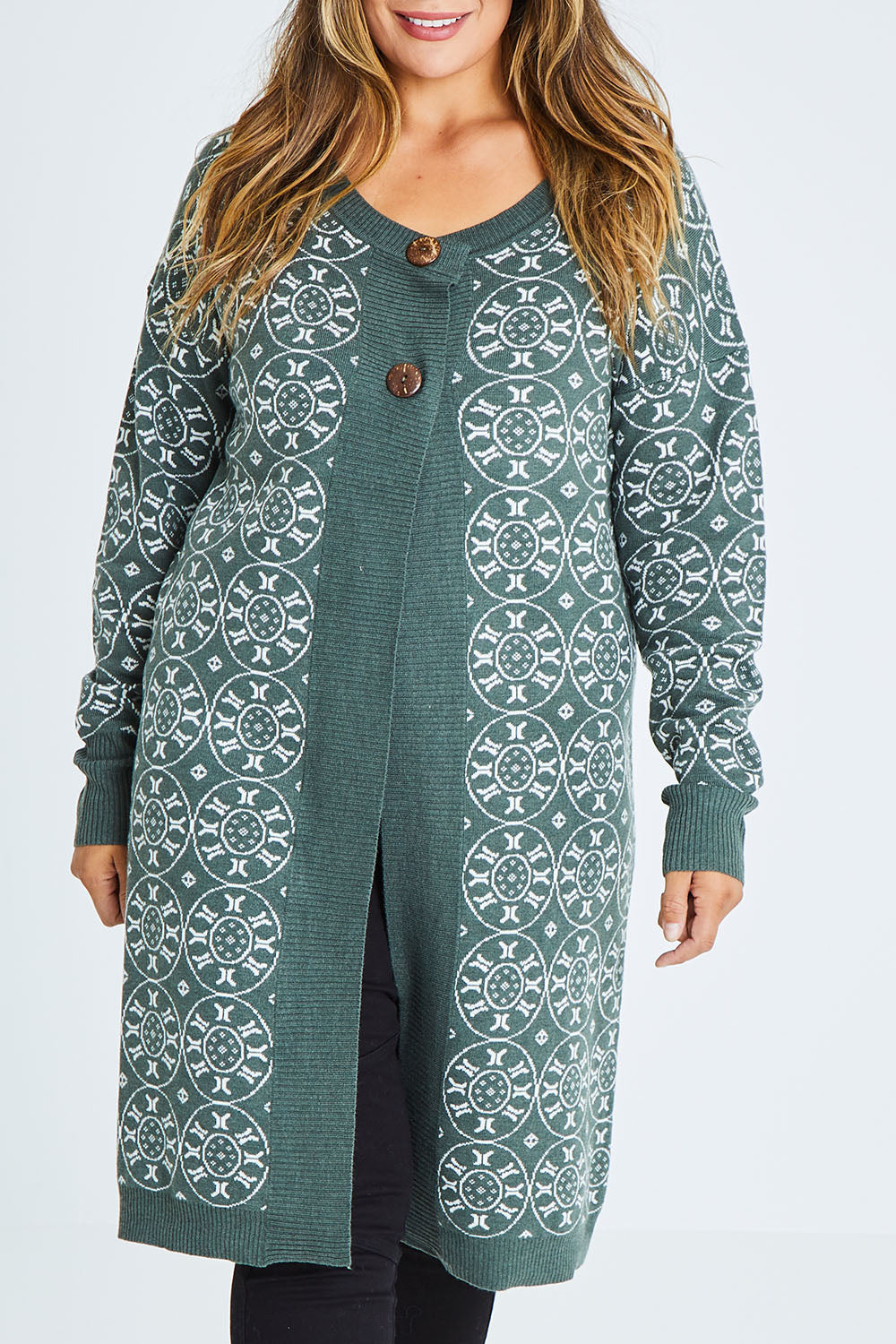 Model Palatina wearing size XL of the Fields Of Folly Cardi in colour Forest (Green), from the front, cropped image