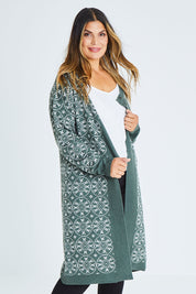 Model Palatina wearing size XL of the Fields Of Folly Cardi in colour Forest (Green), from the front, cropped image