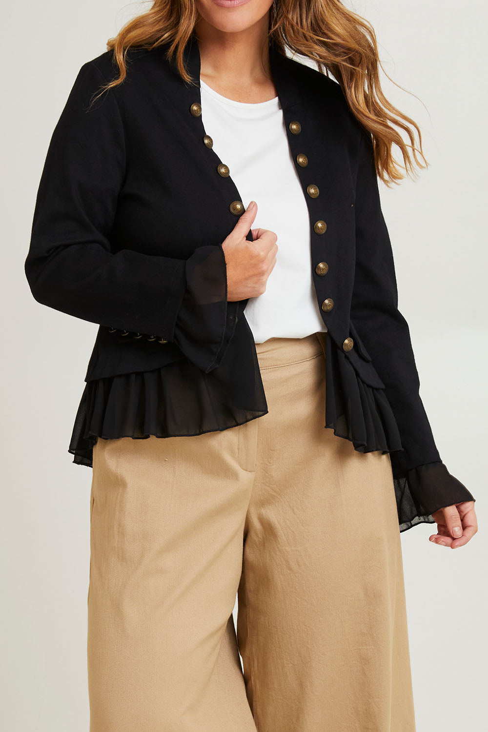Model Laura wearing size 14 of the Commander Of Love Jacket in colour Black (Black), from the front, cropped image