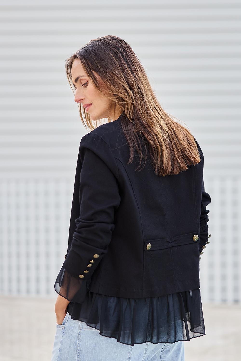 Model Tegand wearing size 10 of the Commander Of Love Jacket - Black in colour Black, from the back