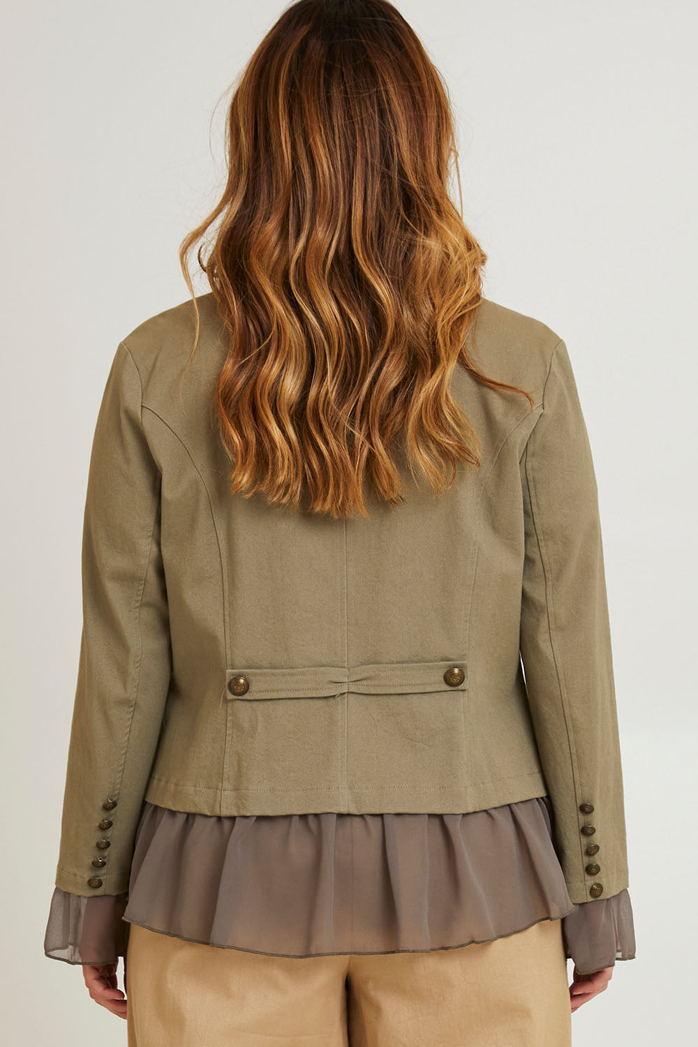 Model Laura wearing size 14 of the Commander Of Love Jacket in colour Khaki (Green), from the back