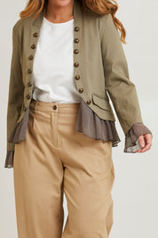 Model Laura wearing size 14 of the Commander Of Love Jacket in colour Khaki (Green), from the front, cropped image