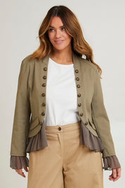 Model Laura wearing size 14 of the Commander Of Love Jacket in colour Khaki (Green), from the front, cropped image