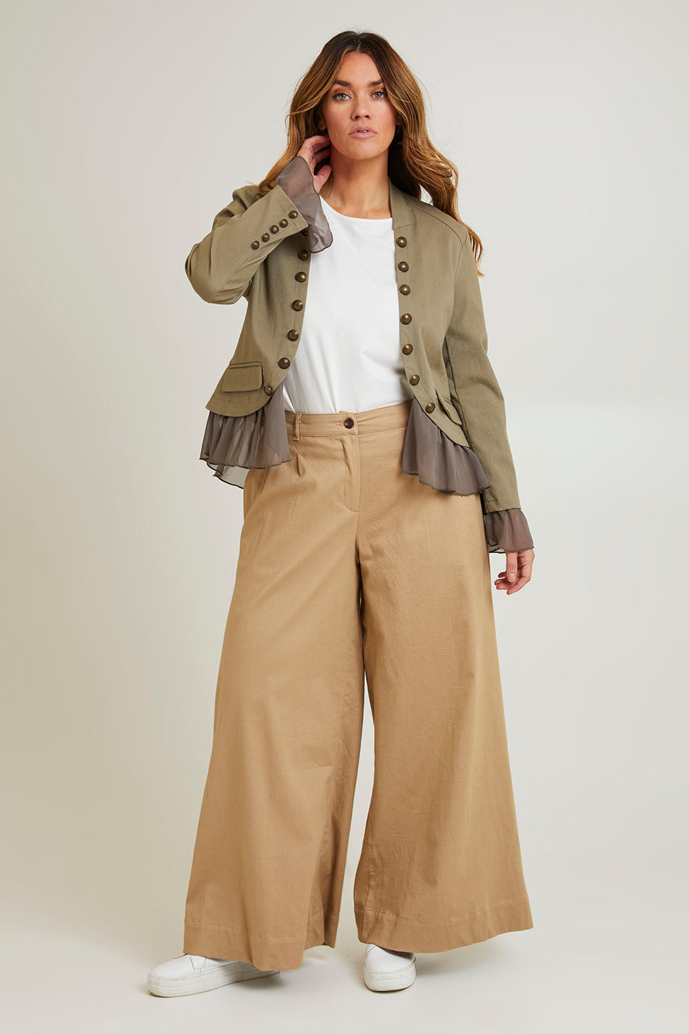 Model Laura wearing size 14 of the Commander Of Love Jacket in colour Khaki (Green), from the front, showing the whole outfit