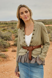 Model Tegan wearing size 10 of the Commander Of Love Jacket in colour Khaki (Green), from the front, showing the whole outfit