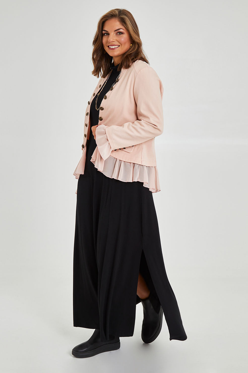 Model Monique wearing size 14 of the Commander Of Love Jacket in colour Palepink (Pink), from the front, showing the whole outfit