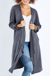 Model Lala wearing size 10 of the Elegant Slumming Cardi in colour Slate (Grey), from the front, cropped image