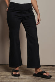 Model Tahnee wearing size 10 of the Easy As Plain Pull On Jeans in colour Black (Black), from the front, cropped image