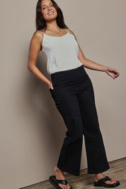 Model Tahnee wearing size 10 of the Easy As Plain Pull On Jeans in colour Black (Black), from the front, showing the whole outfit