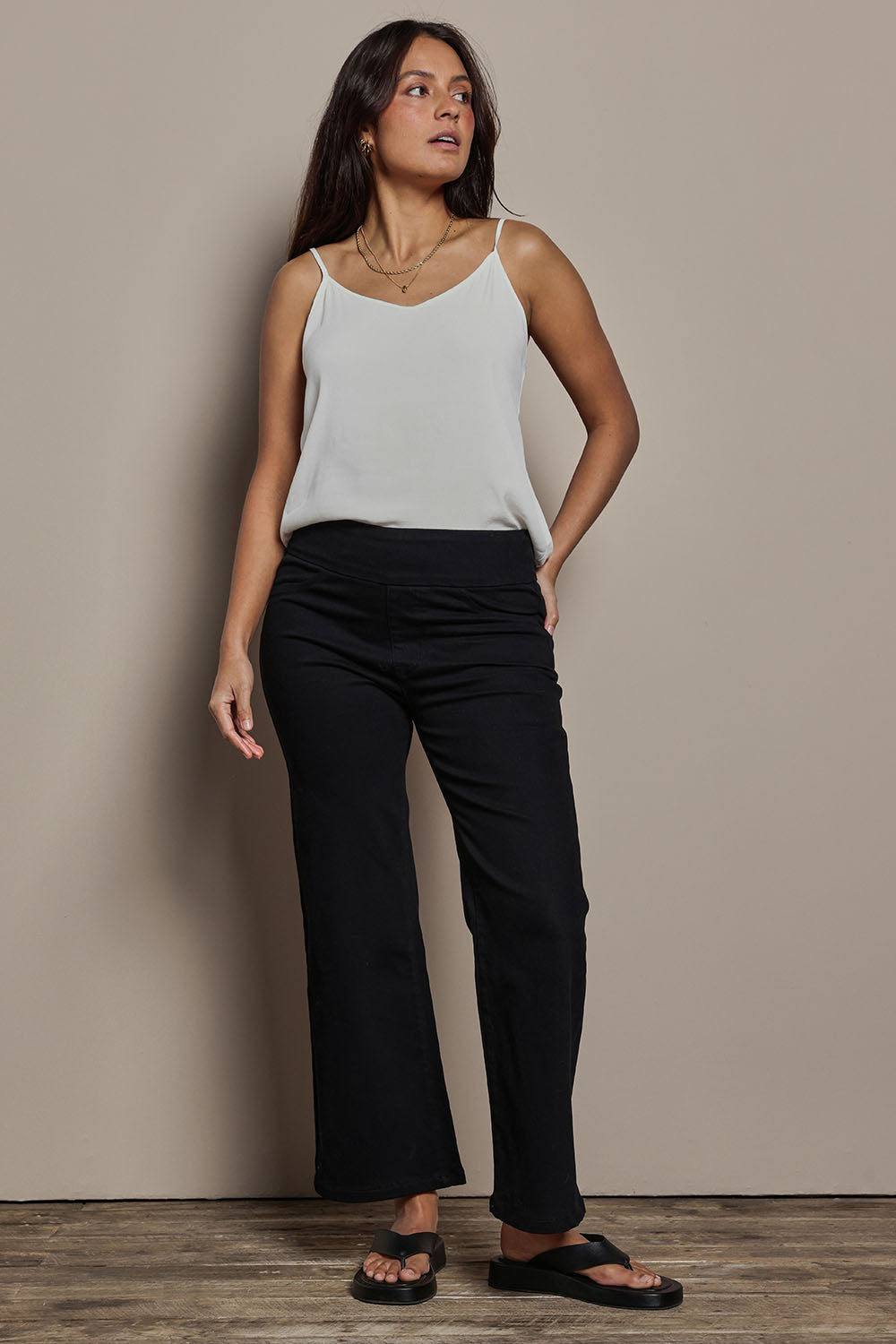 Model Tahnee wearing size 10 of the Easy As Plain Pull On Jeans in colour Black (Black), from the front, showing the whole outfit