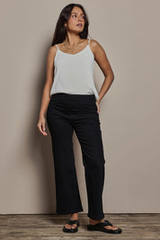 Model Tahnee wearing size 10 of the Easy As Plain Pull On Jeans in colour Black (Black), from the front, showing the whole outfit