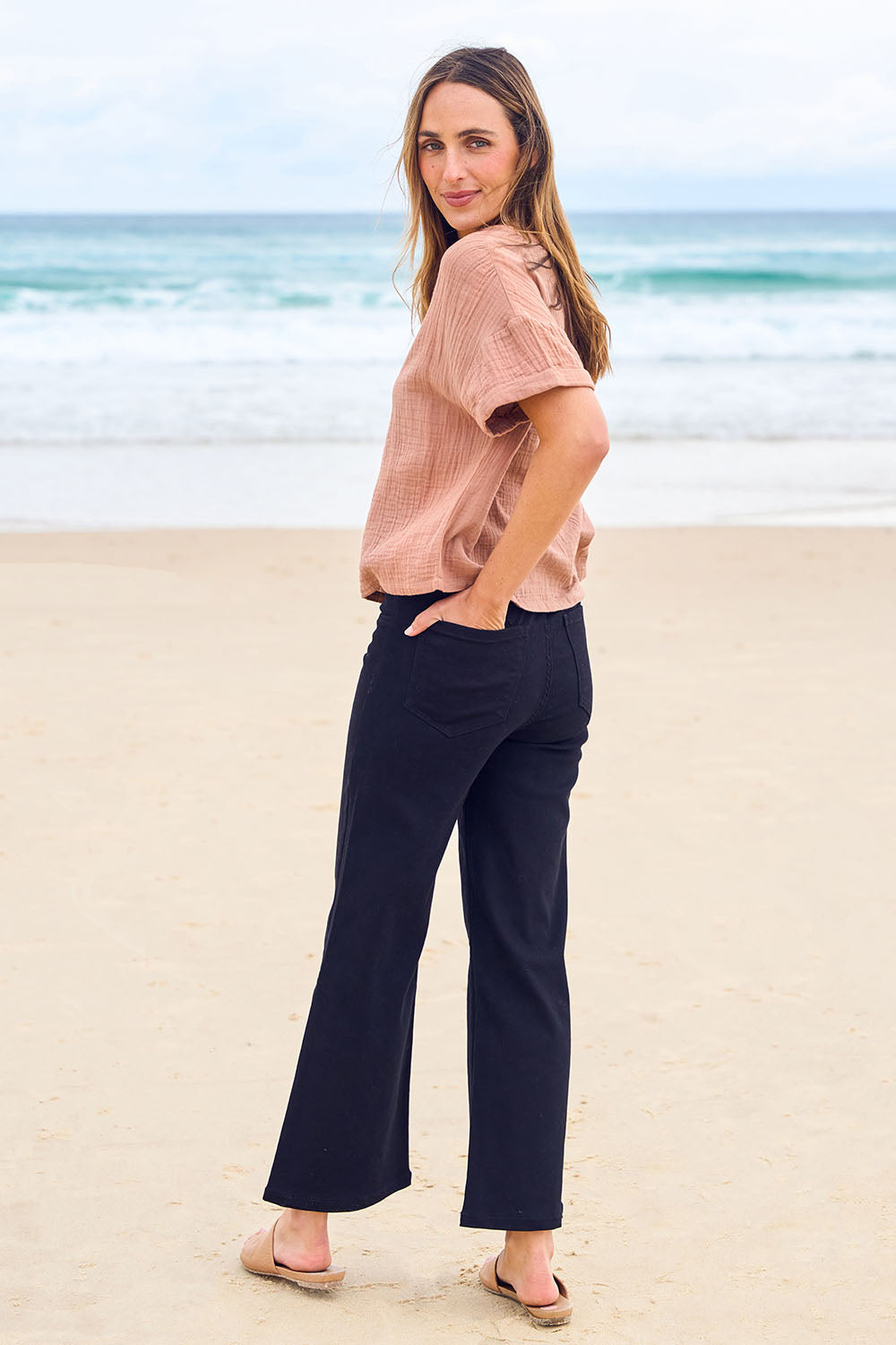 Model Tegan wearing size 10 of the Easy As Plain Pull On Jeans in colour Black (Black), from the front, showing the whole outfit