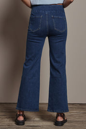 Model Amanda wearing size 10 of the Easy As Plain Pull On Jeans in colour Darkdenim (Blue), from the back
