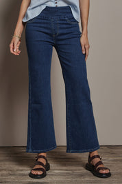 Model Amanda wearing size 10 of the Easy As Plain Pull On Jeans in colour Darkdenim (Blue), from the front, cropped image