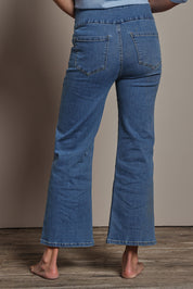 Model Amanda wearing size 10 of the Easy As Plain Pull On Jeans in colour Denim (Blue), from the back