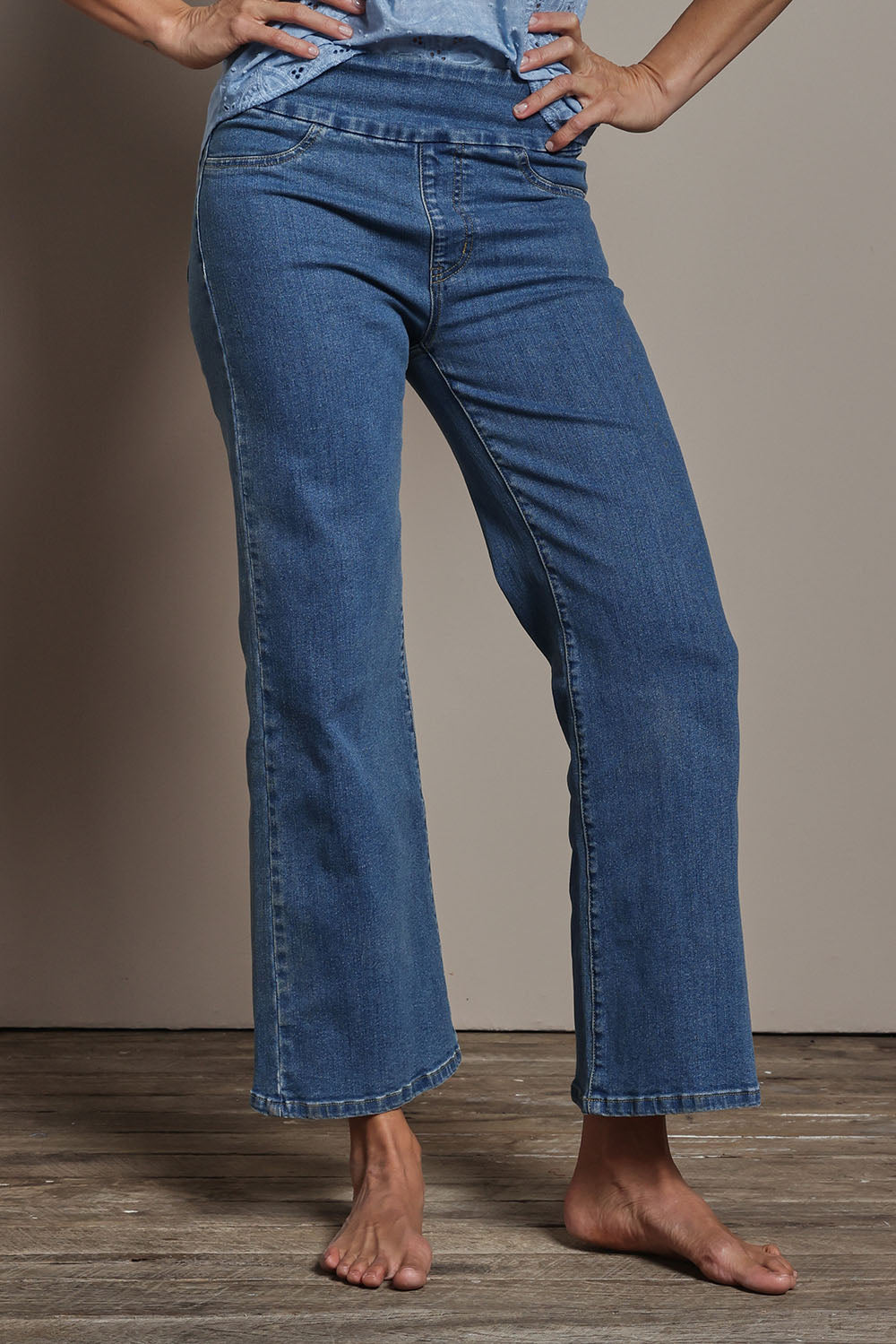 Model Amanda wearing size 10 of the Easy As Plain Pull On Jeans in colour Denim (Blue), from the front, cropped image