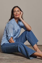 Model Amanda wearing size 10 of the Easy As Plain Pull On Jeans in colour Denim (Blue), from the front, showing the whole outfit