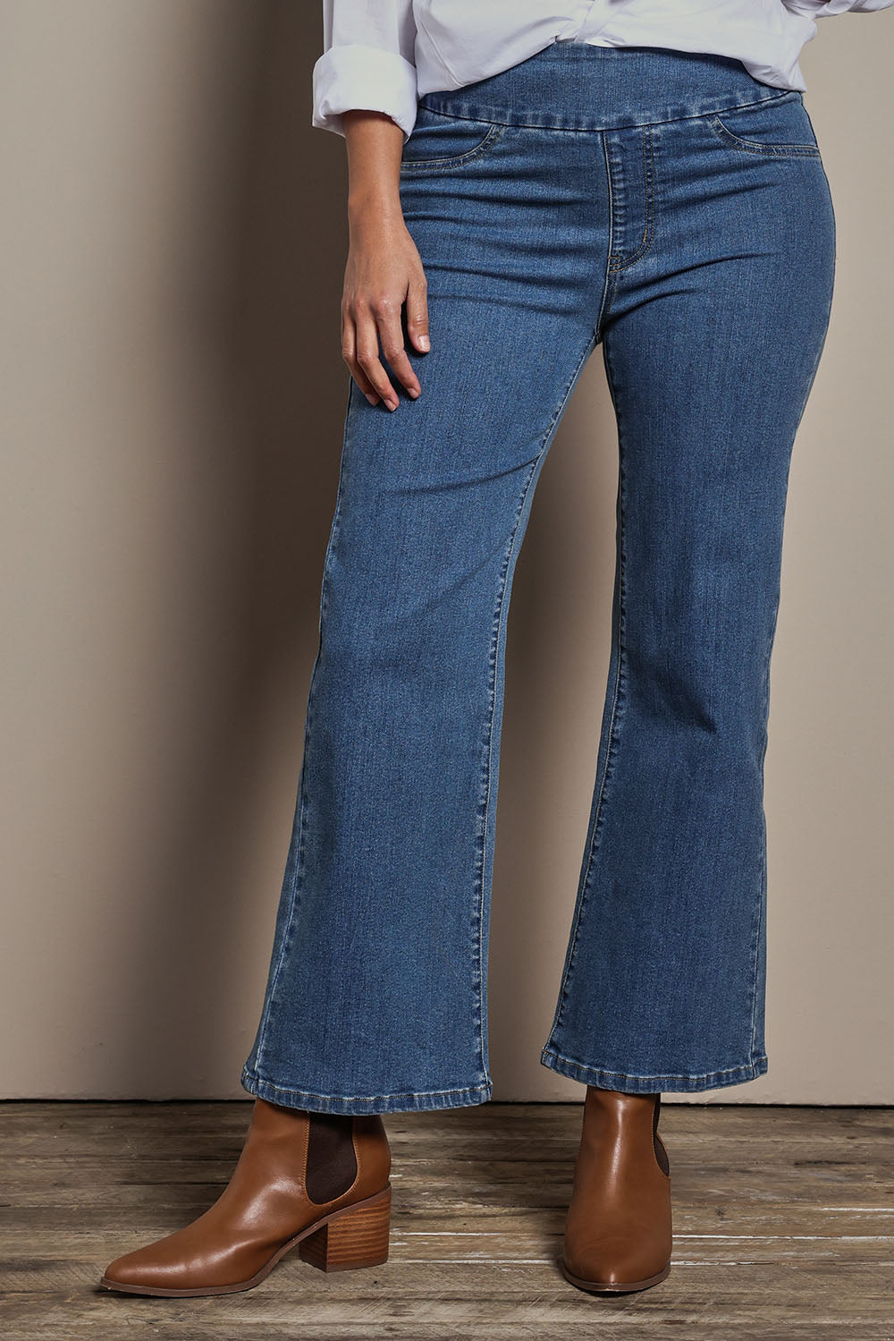 Model Tahnee wearing size 10 of the Easy As Plain Pull On Jeans in colour Denim (Blue), from the front, cropped image
