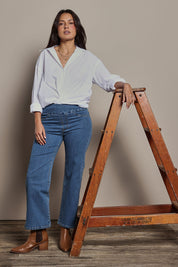 Model Tahnee wearing size 10 of the Easy As Plain Pull On Jeans in colour Denim (Blue), from the front, showing the whole outfit