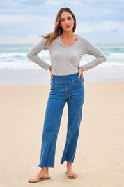 Model Tegan wearing size 10 of the Easy As Plain Pull On Jeans in colour Denim (Blue), from the front, showing the whole outfit