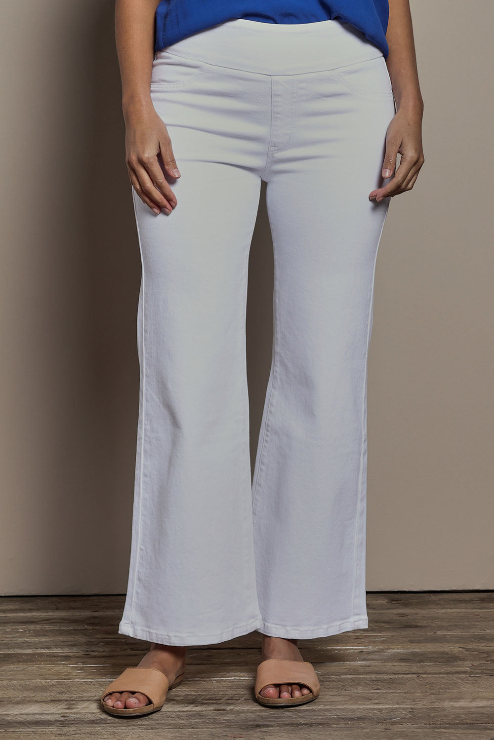Model Tahnee wearing size 10 of the Easy As Plain Pull On Jeans in colour White (White), from the front, cropped image