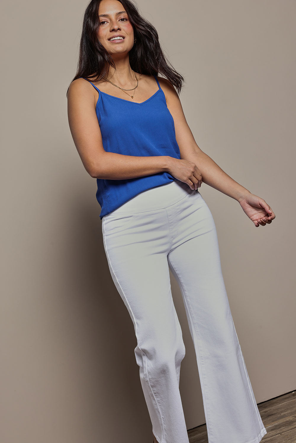 Model Tahnee wearing size 10 of the Easy As Plain Pull On Jeans in colour White (White), from the front, cropped image