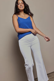 Model Tahnee wearing size 10 of the Easy As Plain Pull On Jeans in colour White (White), from the front, cropped image