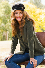 Model Ilona wearing size 10 of the Highland Cord Blazer in colour Pine (Green), from the front, showing the whole outfit