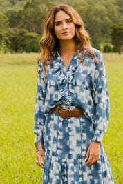 Model Ilona wearing size 10 of the For The Frill Of It Shirt in colour Blue (Blue), from the front, showing the whole outfit