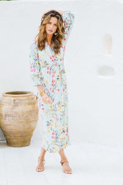 Model Ilona wearing size 10 of the Freedom Faux Wrap Maxi Dress in colour Blossom (Blue), from the front, showing the whole outfit