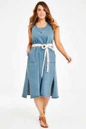Model Laura wearing size 14 of the Wrap Your Arms Around Me Denim Dress in colour Denim (Blue), from the front, showing the whole outfit