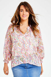 Model Laura wearing size 14 of the Bright As A Button Blouse in colour Confetti (White), from the front, cropped image