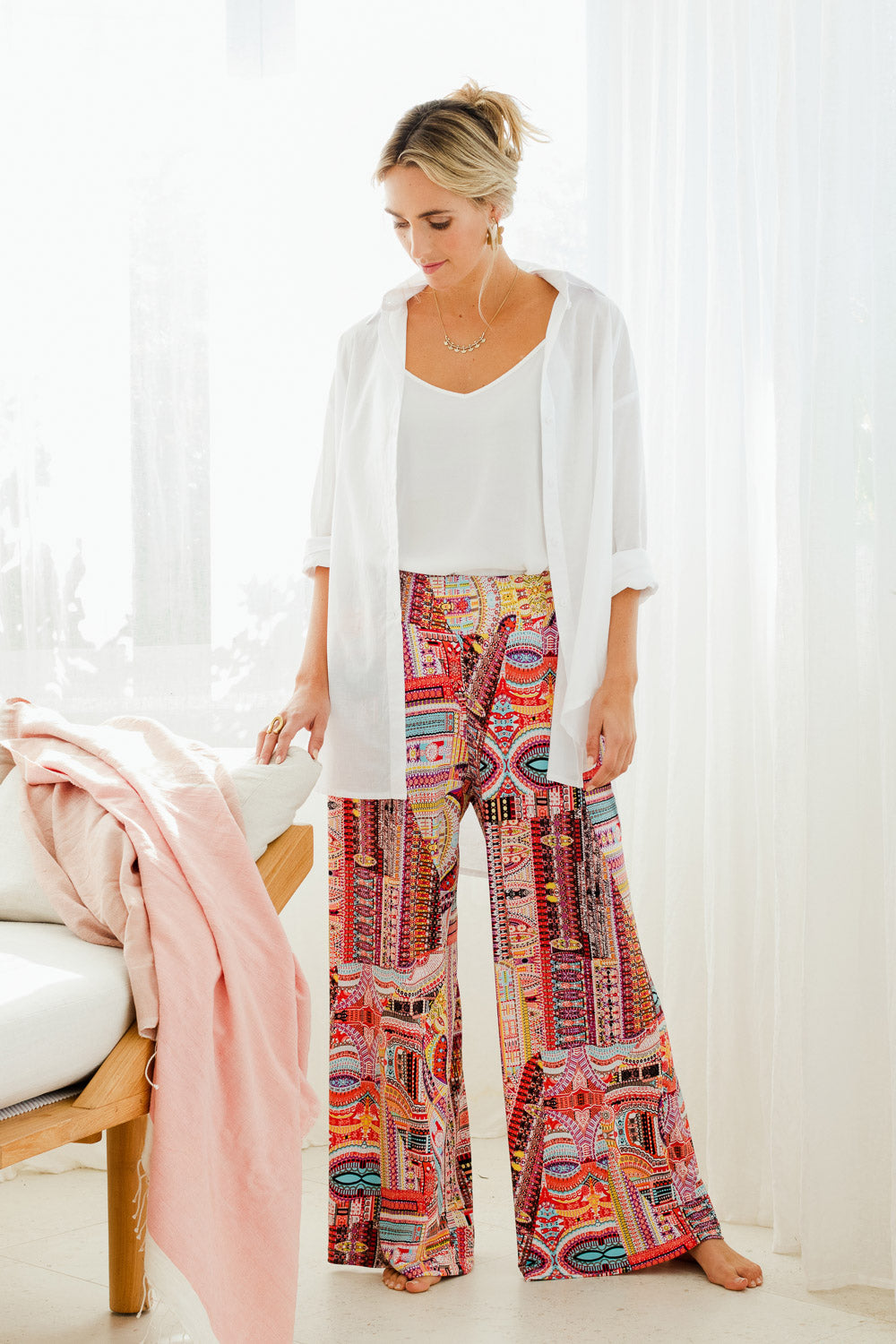 Model Tegan wearing size 10 of the Pretty Patch Pants in colour Bright (Red), from the front, showing the whole outfit