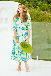 Model Ilona wearing size 10 of the Here Comes The Sun Dress in colour Bluegreen (Blue), from the front, showing the whole outfit