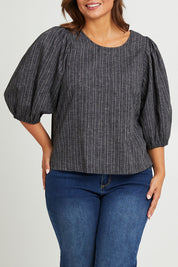 Model Monique wearing size 14 of the Ive Got Your Back Blouse in colour Blackwhite (Black), from the front, cropped image