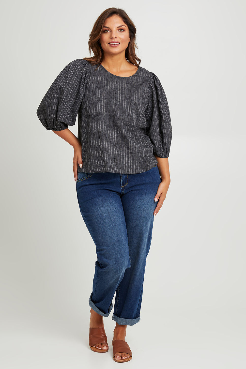 Model Monique wearing size 14 of the Ive Got Your Back Blouse in colour Blackwhite (Black), from the front, showing the whole outfit