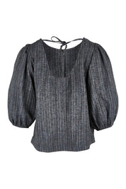 Product shot of the Ive Got Your Back Blouse in colour Blackwhite (Black), from the back