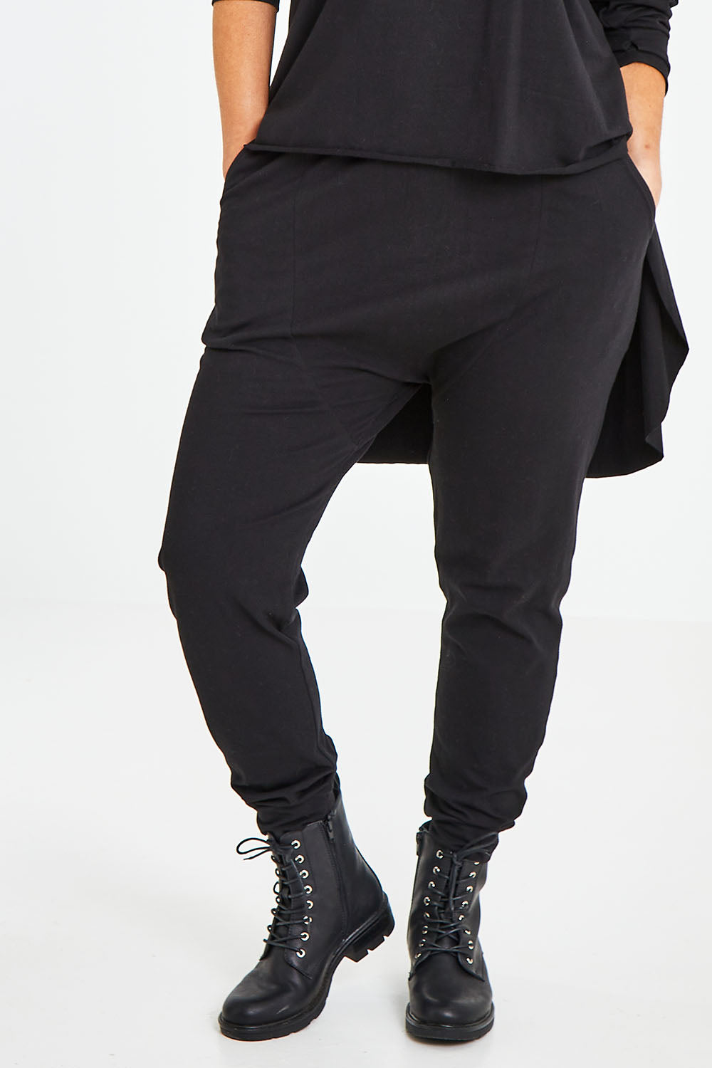 Model Laura wearing size 14 of the Easy Living Pants in colour Black (Black), from the front, cropped image